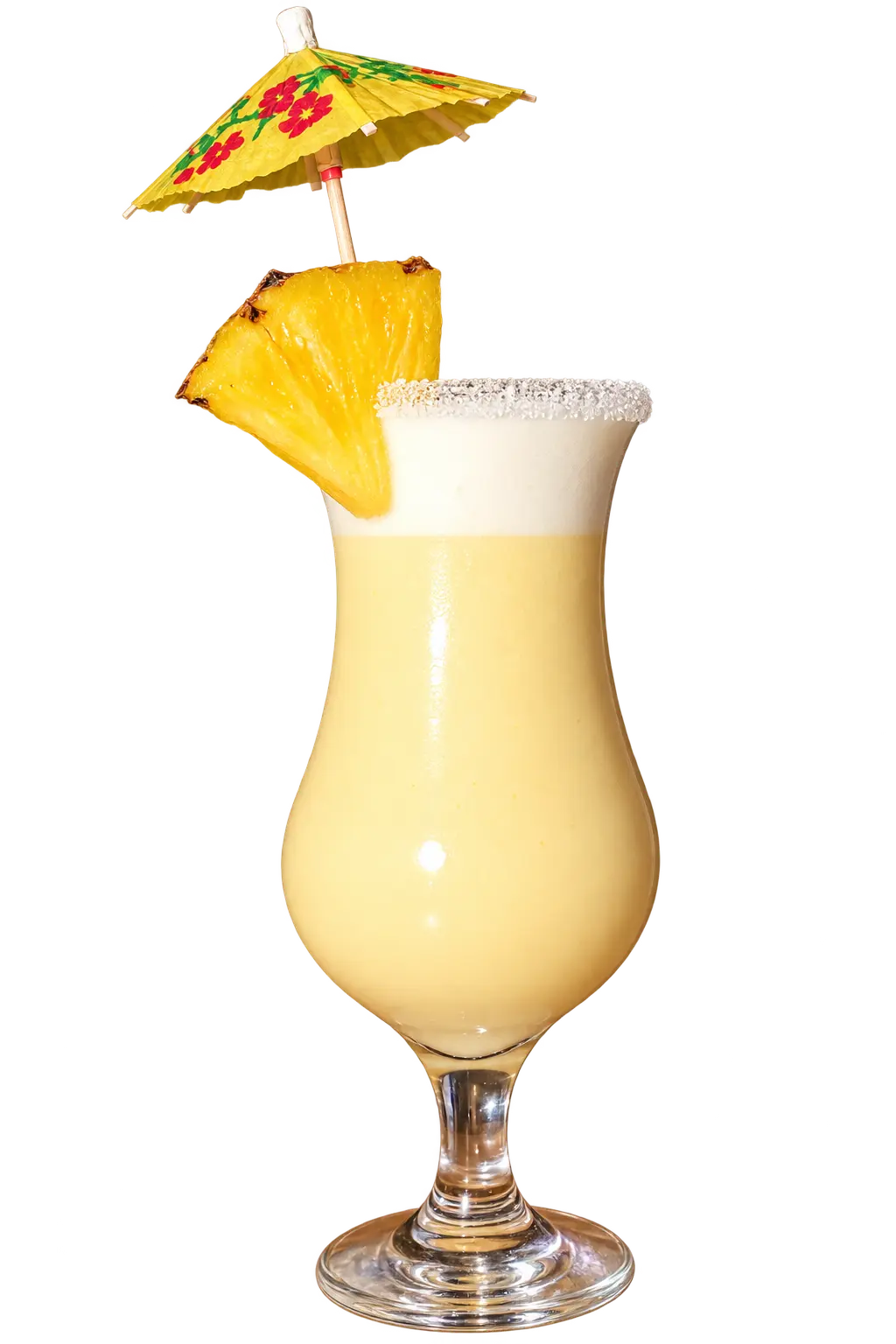 Piña colada servida en copa con sombrilla decorativa y trozo de piña